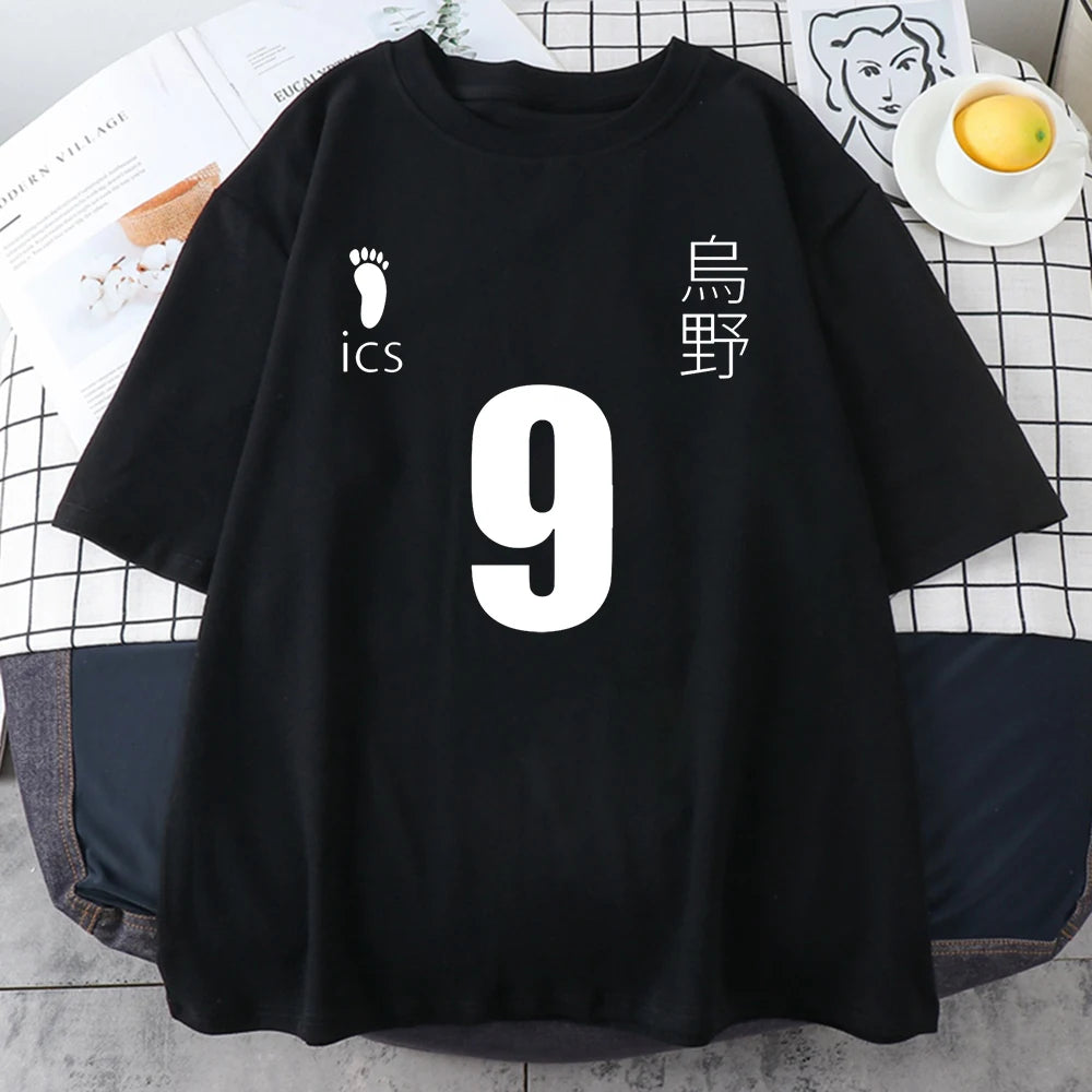 Black t-shirt with white text and numbers on a checkered surface